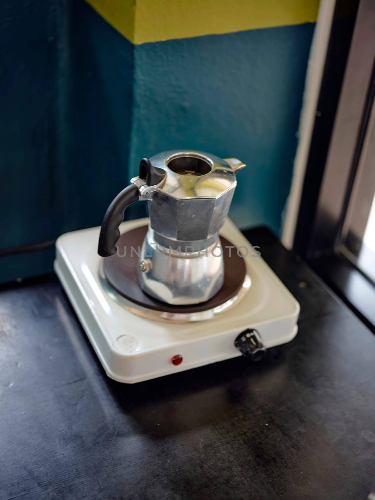 An Italian coffee machine called a moka pot on stove