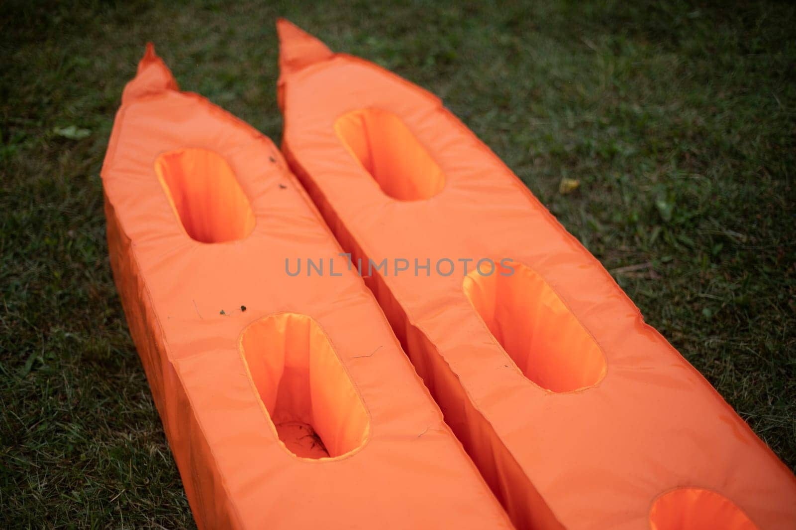 Sports equipment. Orange sports equipment. Item to play with. Things on site.