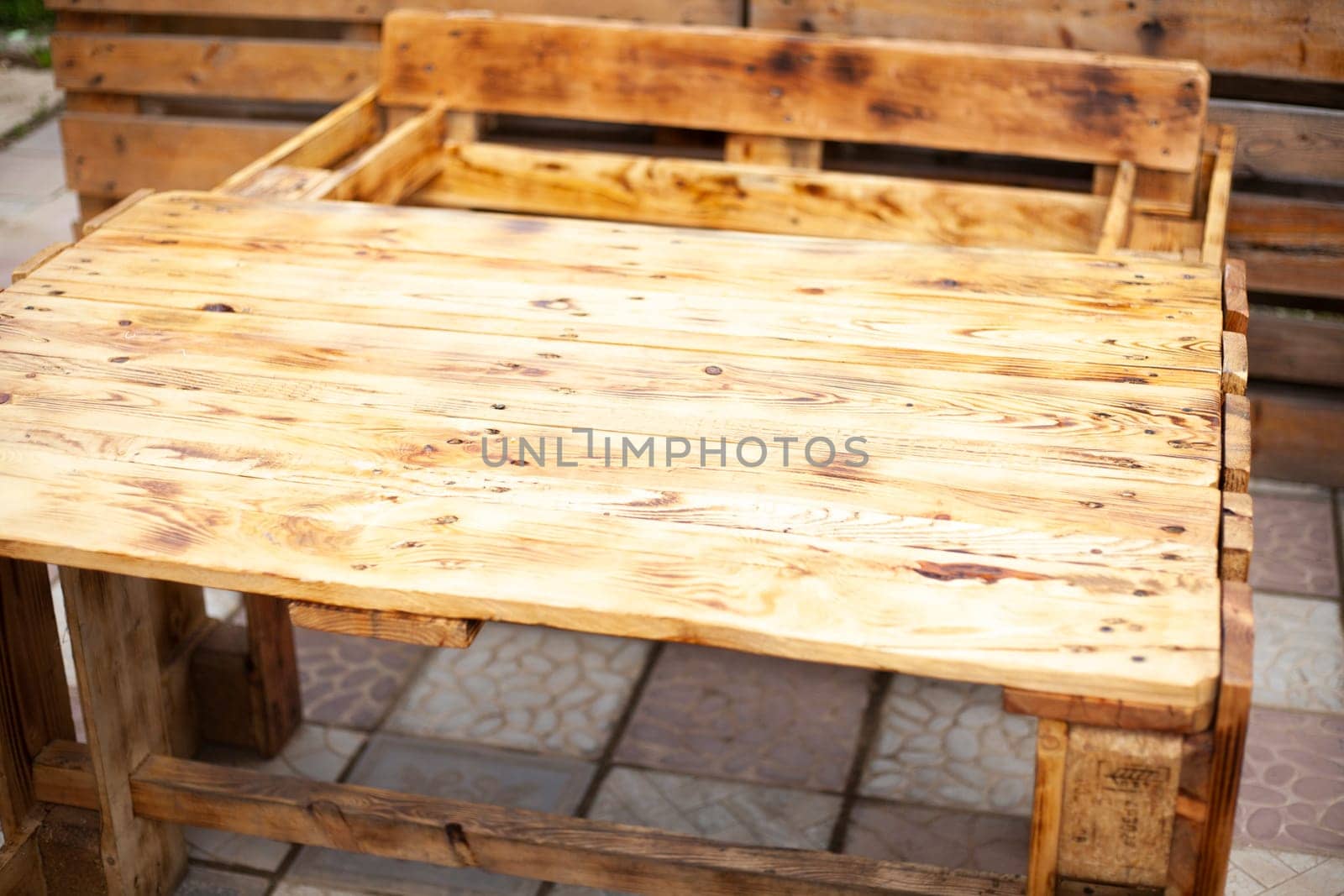 Craft table. Table of boards. Wooden furniture. Outdoor bar. Interior details.