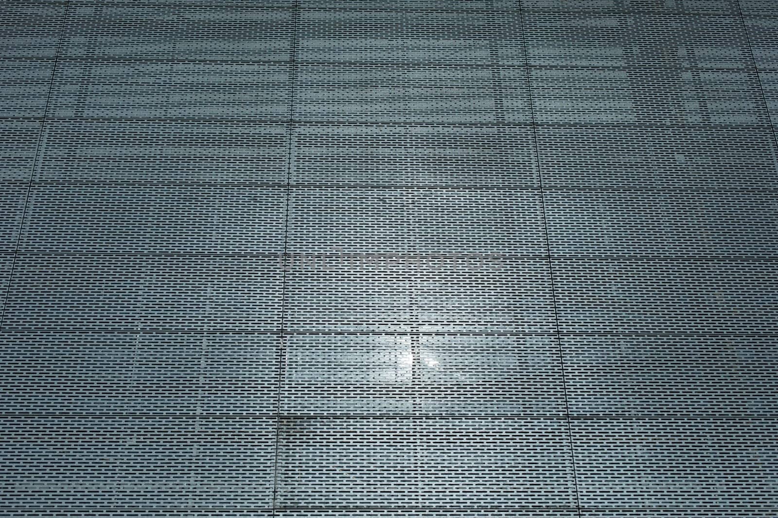 Steel wall of building. Grille on wall. Office building. Texture architecture.