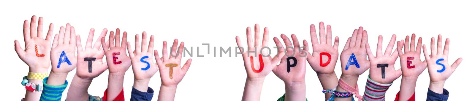 Children Hands Building Colorful English Word Latest Updates. Isolated White Background.