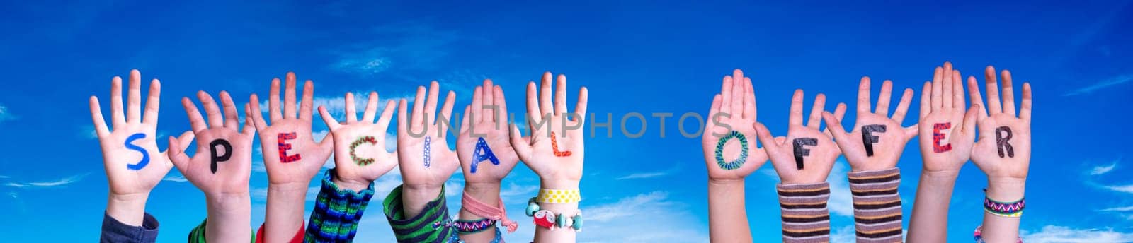 Children Hands Building Colorful English Word Special Offer. Blue Sky As Background.