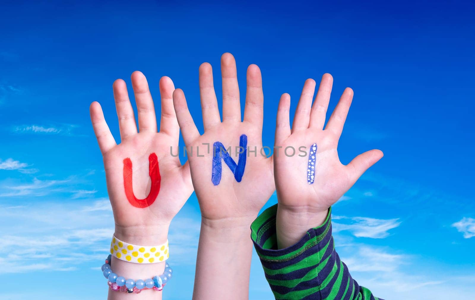 Children Hands Building Colorful German Word Uni Means University. Blue Sky As Background.