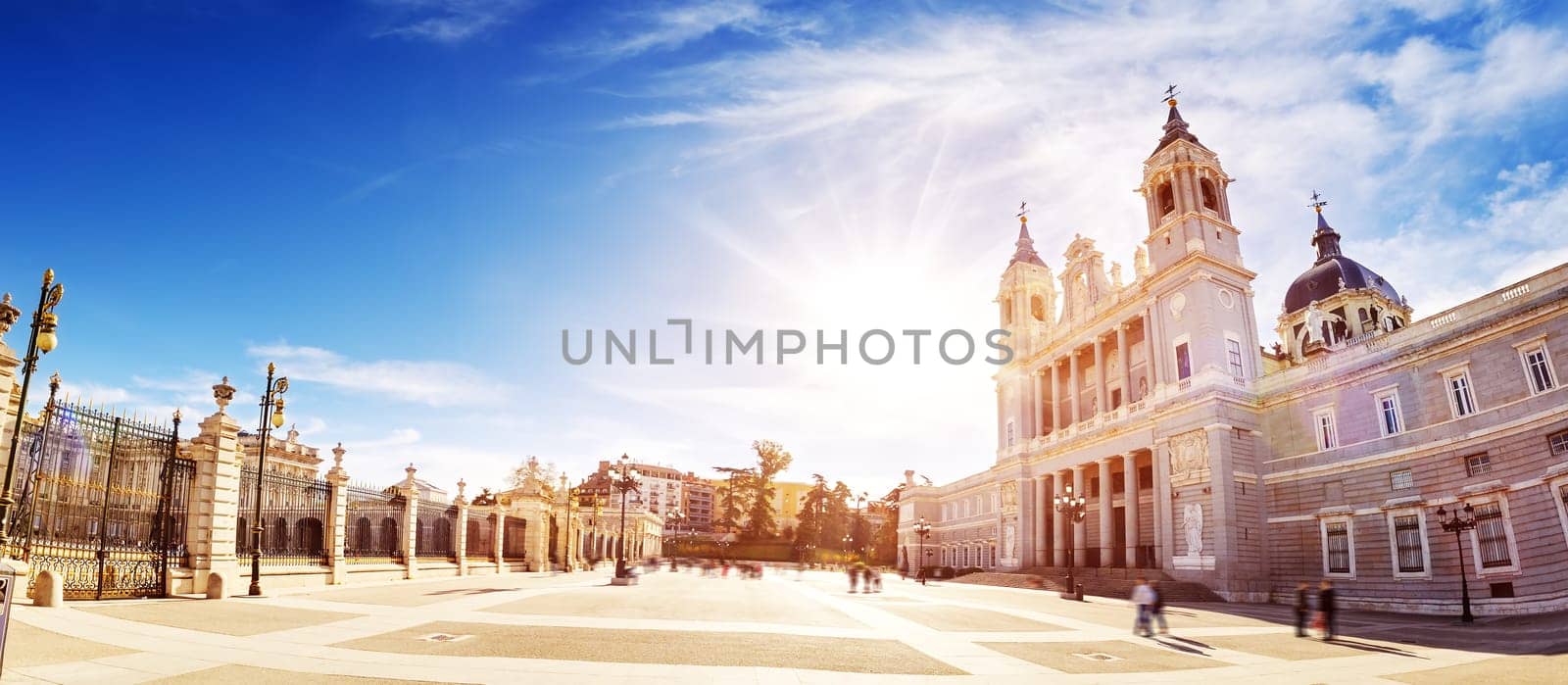 Beautiful background of the Catedral de Santa Maria la Real de la Almudena on the Plaza de la Armeria. View on the Palacio Real de Madrid.