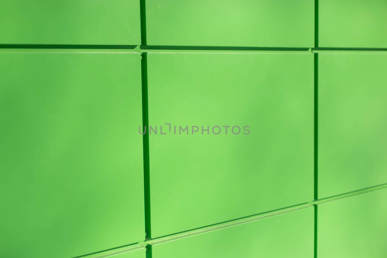 Green Wall. Building panels. They were at office house. Light green surface.