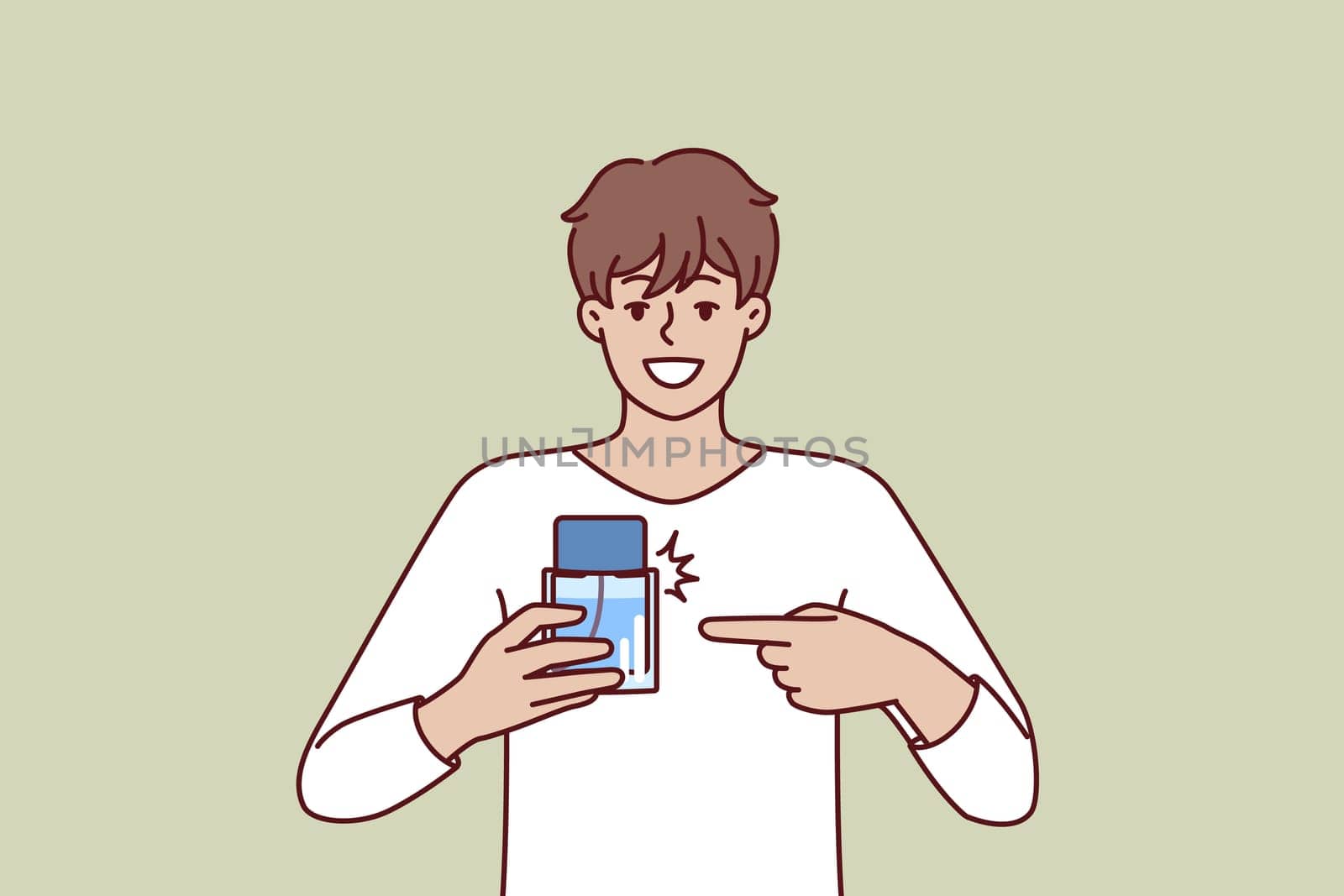 Man pointing finger at perfume bottle recommending to buy cologne or antiperspirant with cool scent. Happy guy employee of perfume shop holding sample of deodorant that protects against bad smell