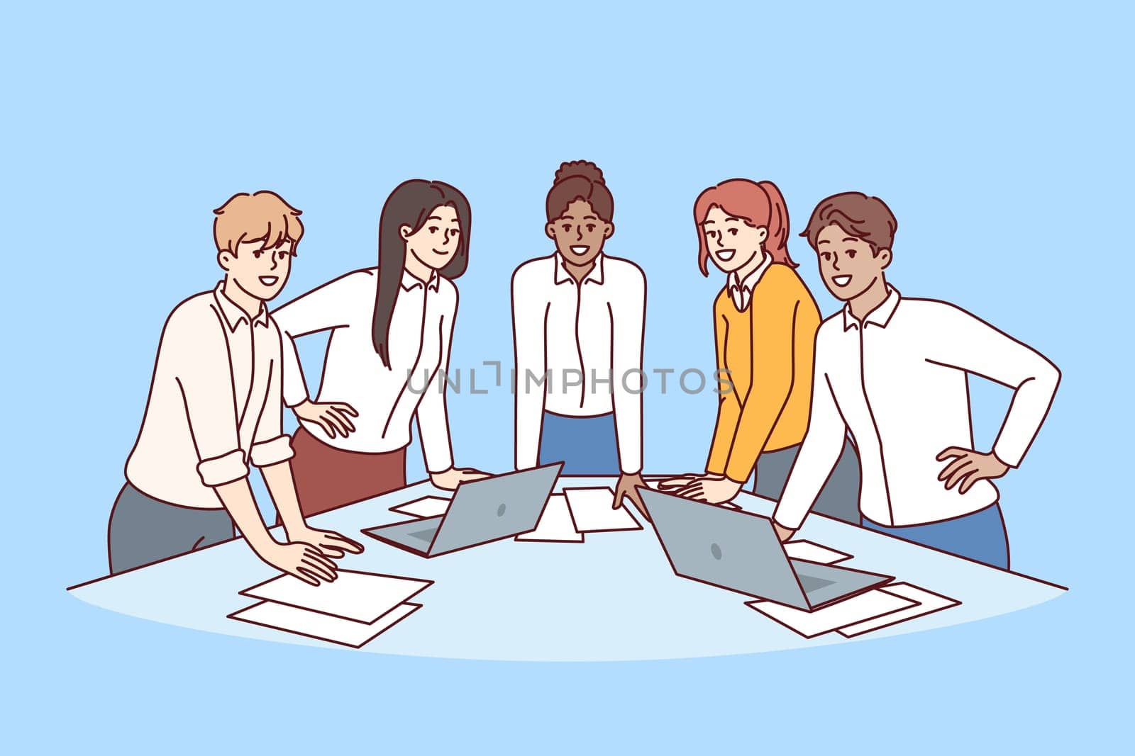 Team diverse business people stand at table with papers and laptops discussing company marketing strategy. Meeting in modern startup with team of young men and women engaged in corporate consulting