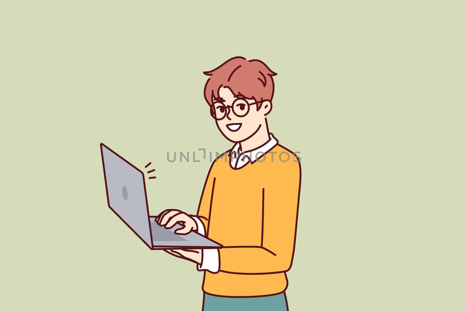 Smart little boy with open laptop for preparing homework assigned from school stands and looks at camera. Schoolboy in casual wear holding laptop using internet and learning software development