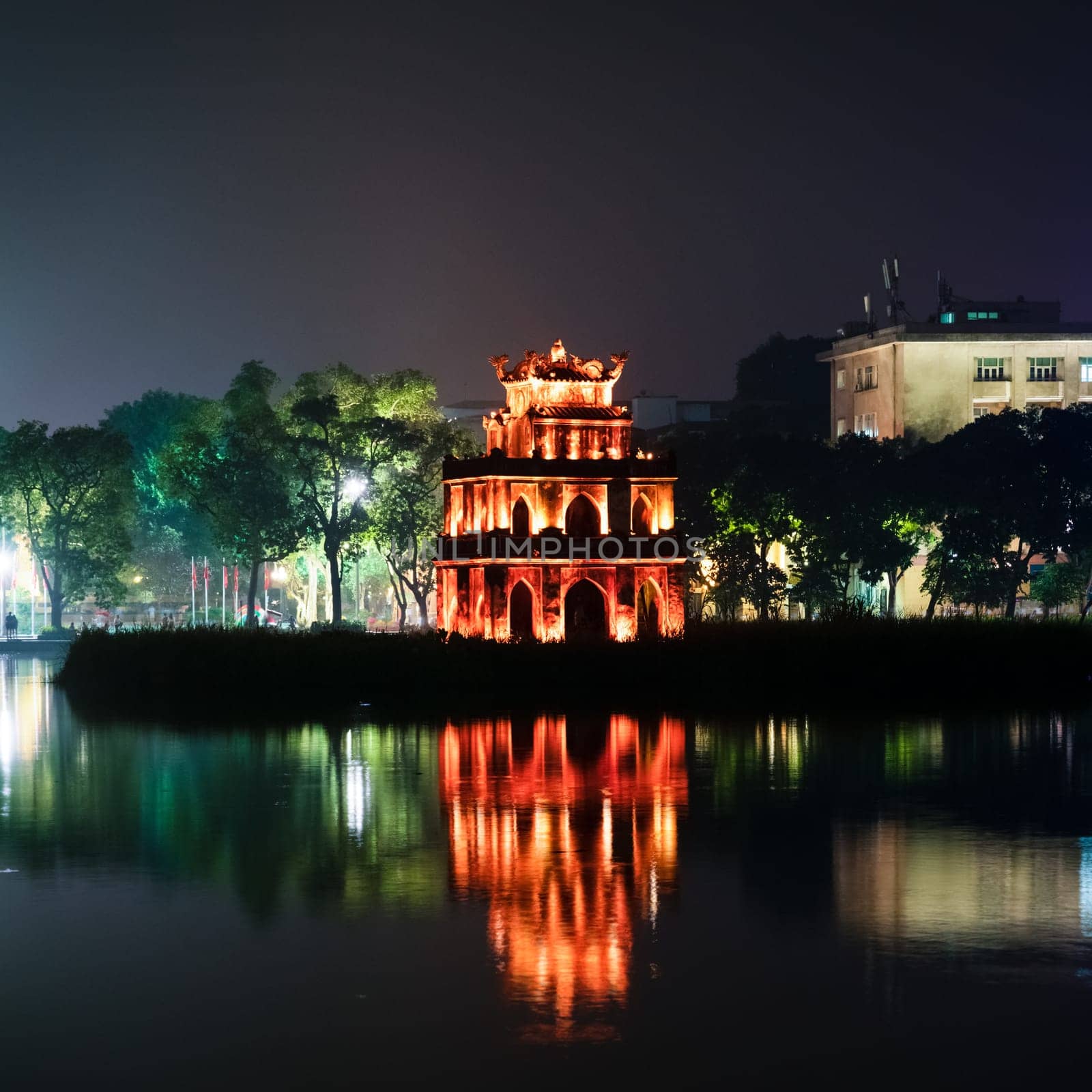 Nighttime view of a pagoda in Hoan Kiem Lake park