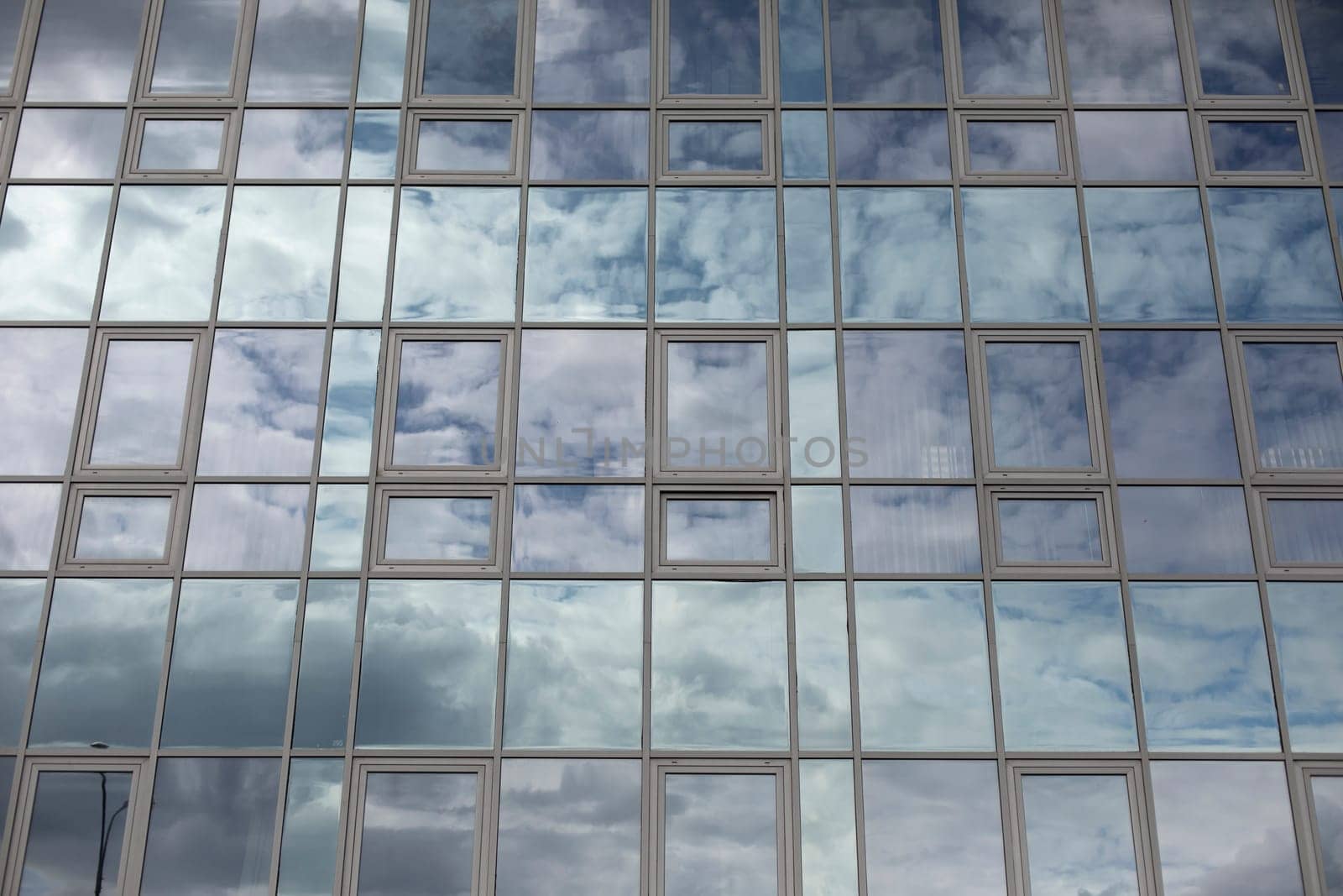 Windows in building. Mirror surface in building. Office house.