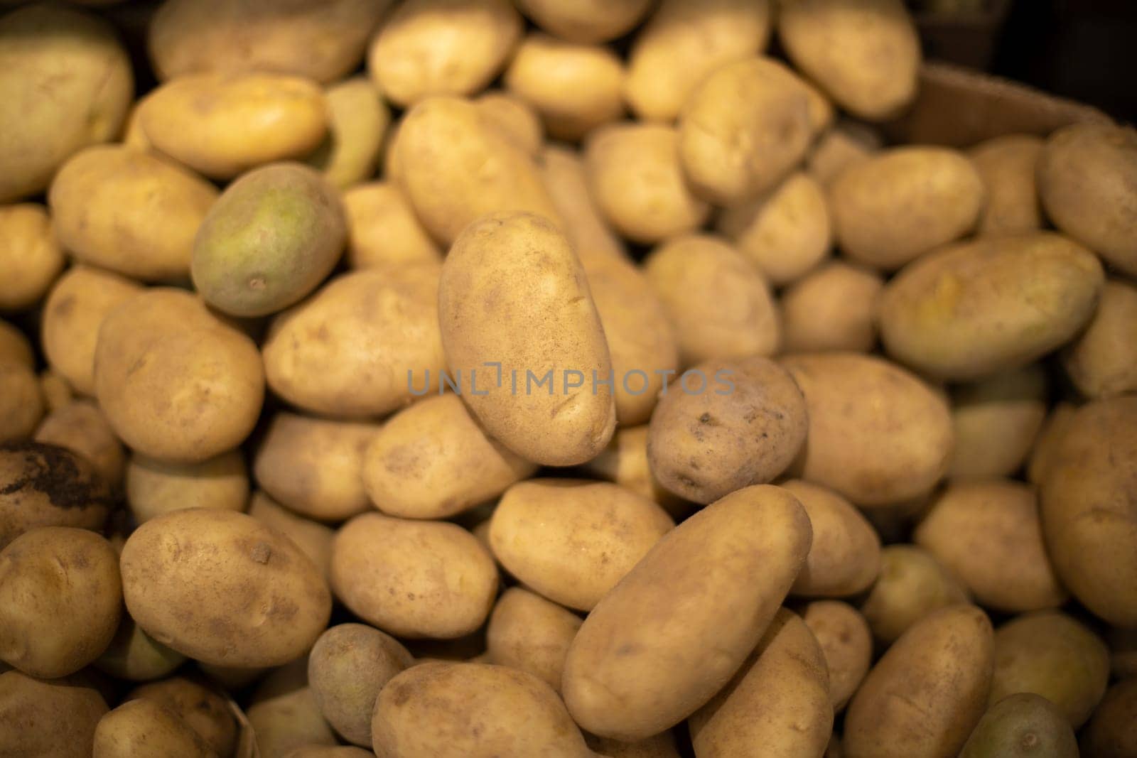 Potatoes from garden. Root vegetable on market. Potato texture.