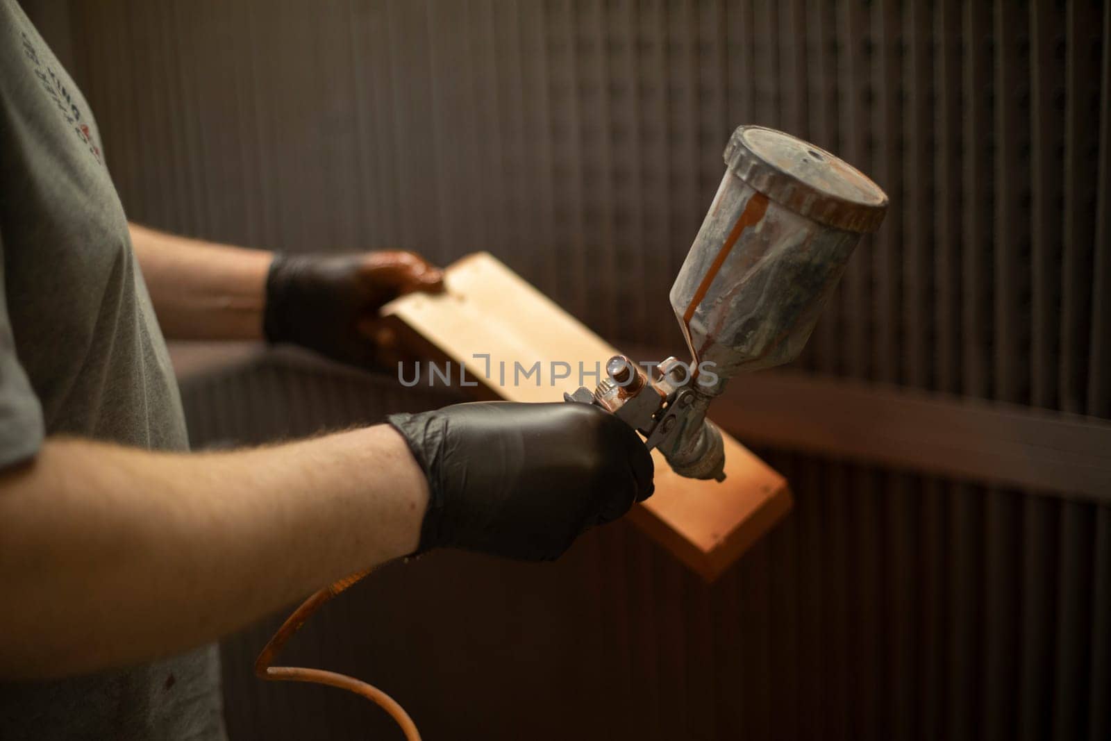 Painting part with brown paint. Paint on wood.