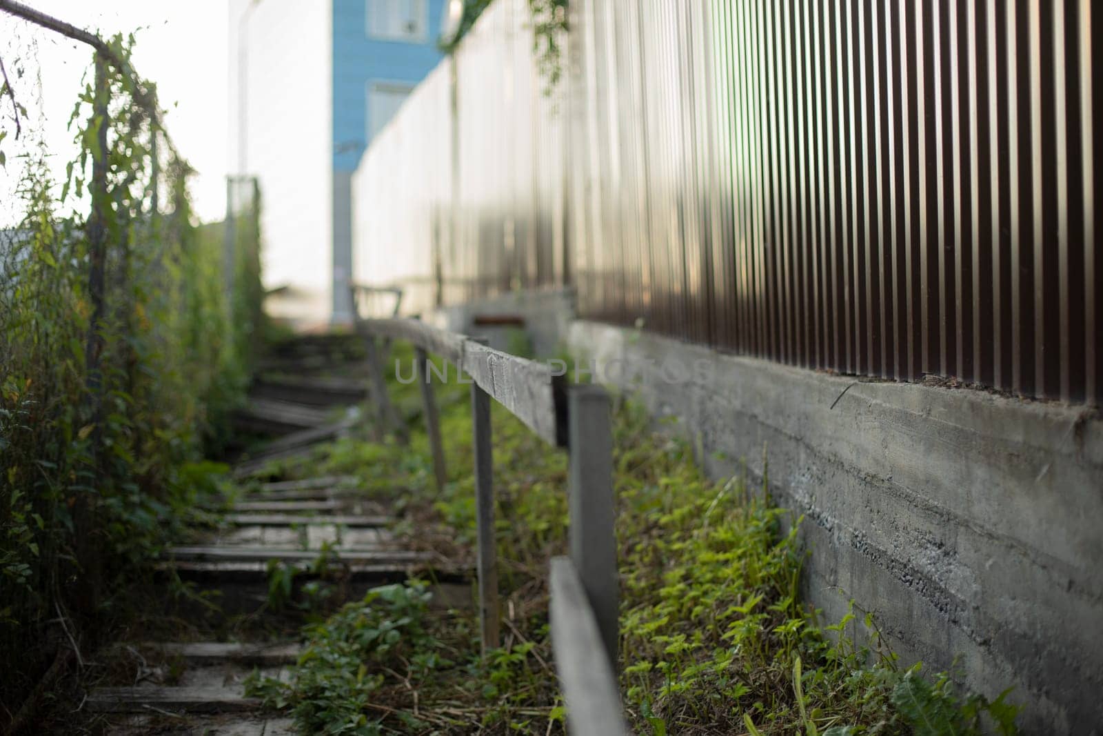 Fence made of steel. Steel fence profile. Private territory. Details of fence.