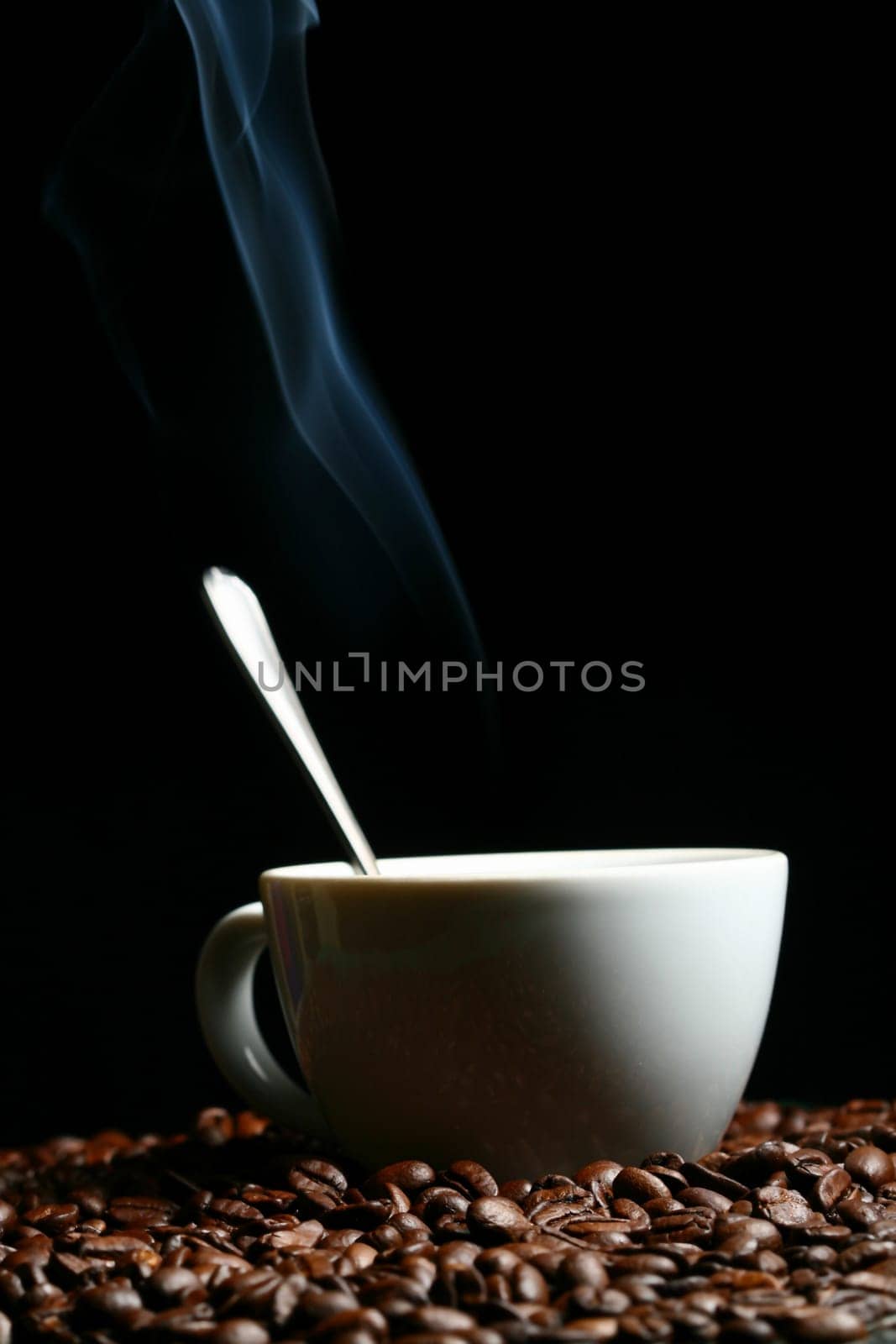 coffee beans and white hot cup of drink