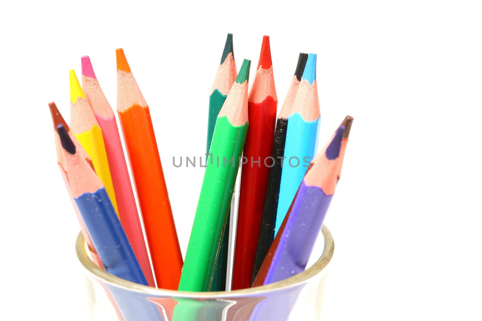 color pencil in glass macro close up on white