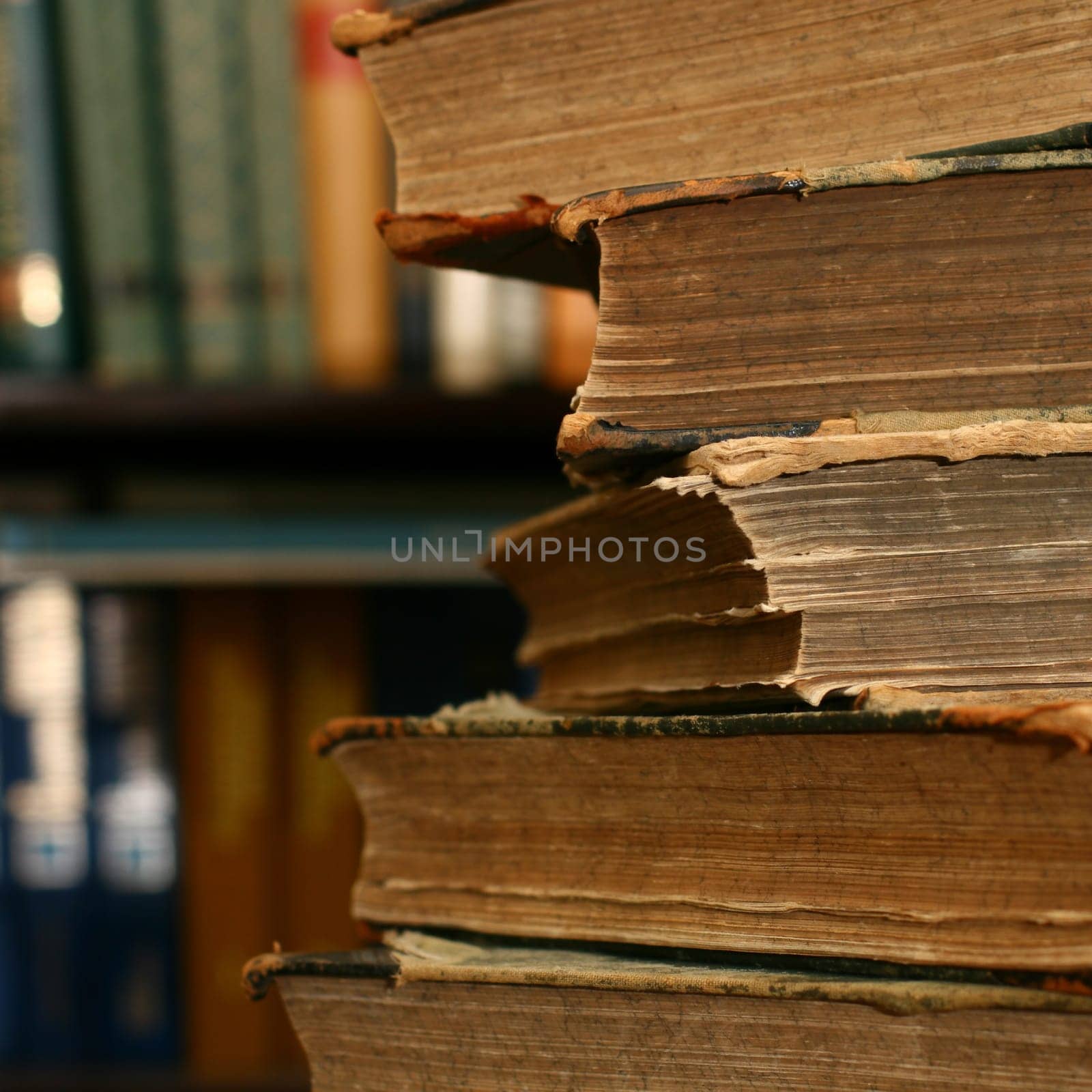 books on table in dark library room