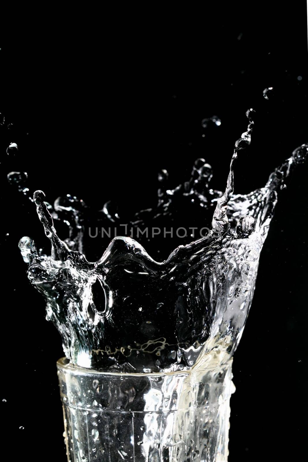 splash in glass on dark background