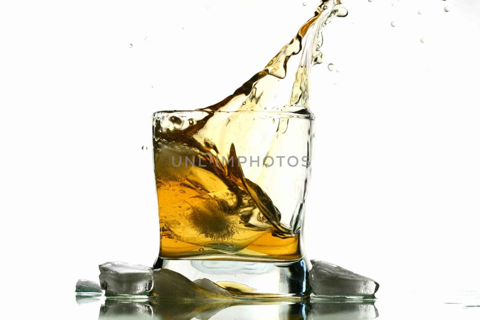 whisky splash alcohol drops isolated on white