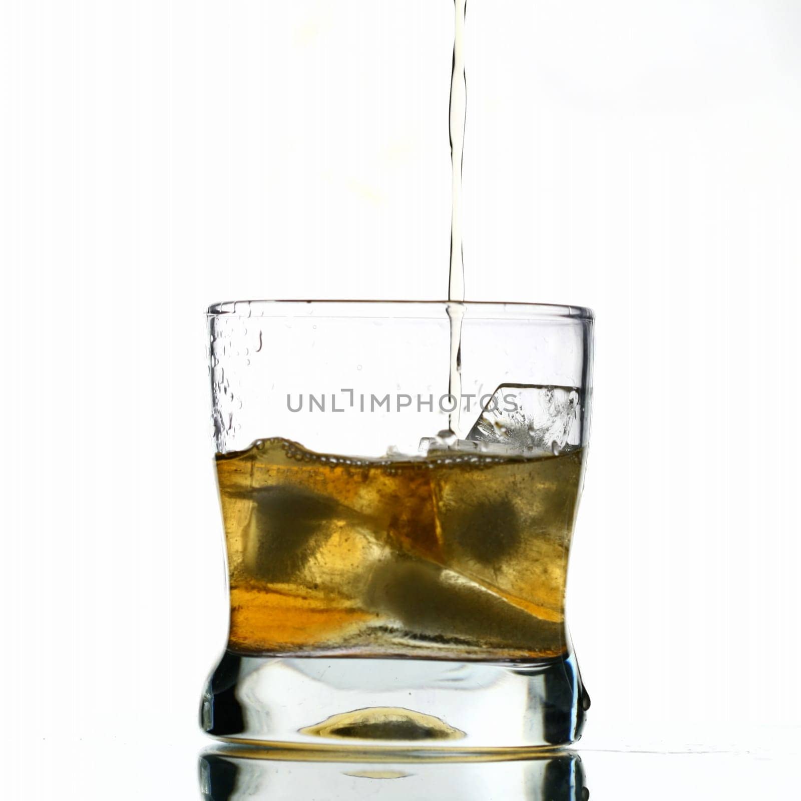whisky splash alcohol drops isolated on white