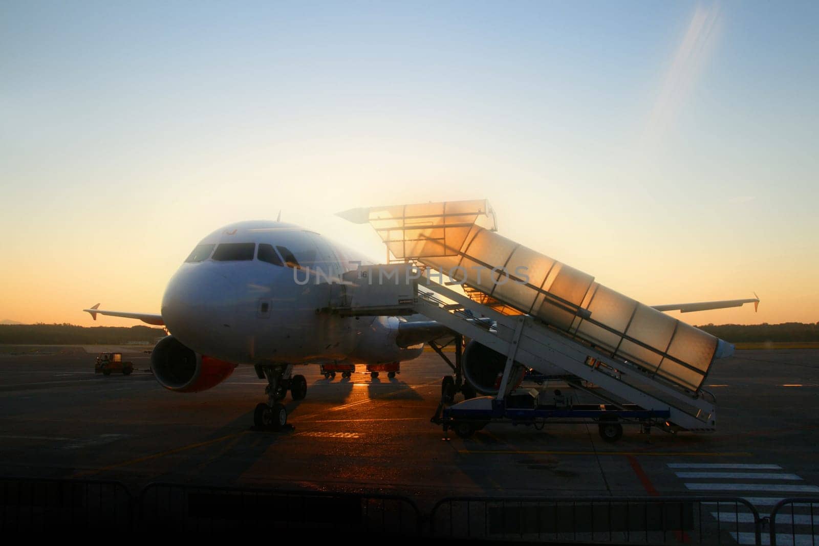 Airplane and sunrise in irport 6:00
