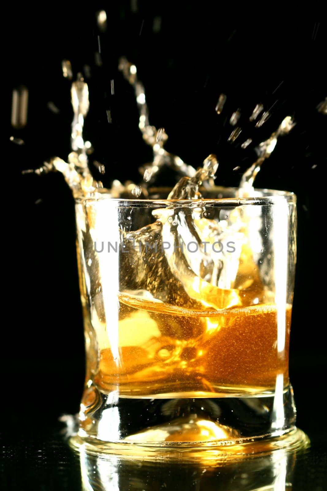 whiskey splash on black background