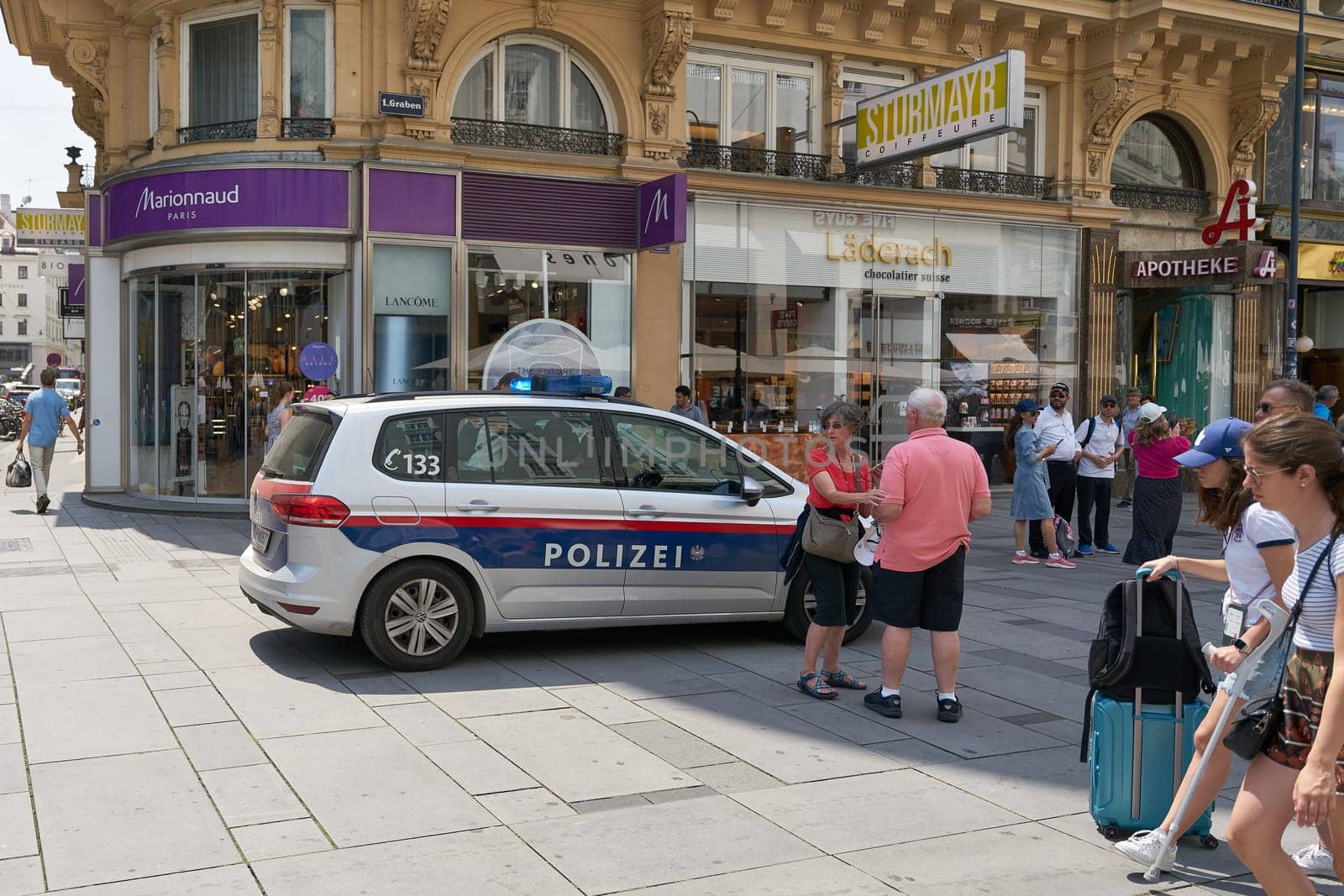 Police car during a police operation in a shopping street in the center of Vienna in Austria