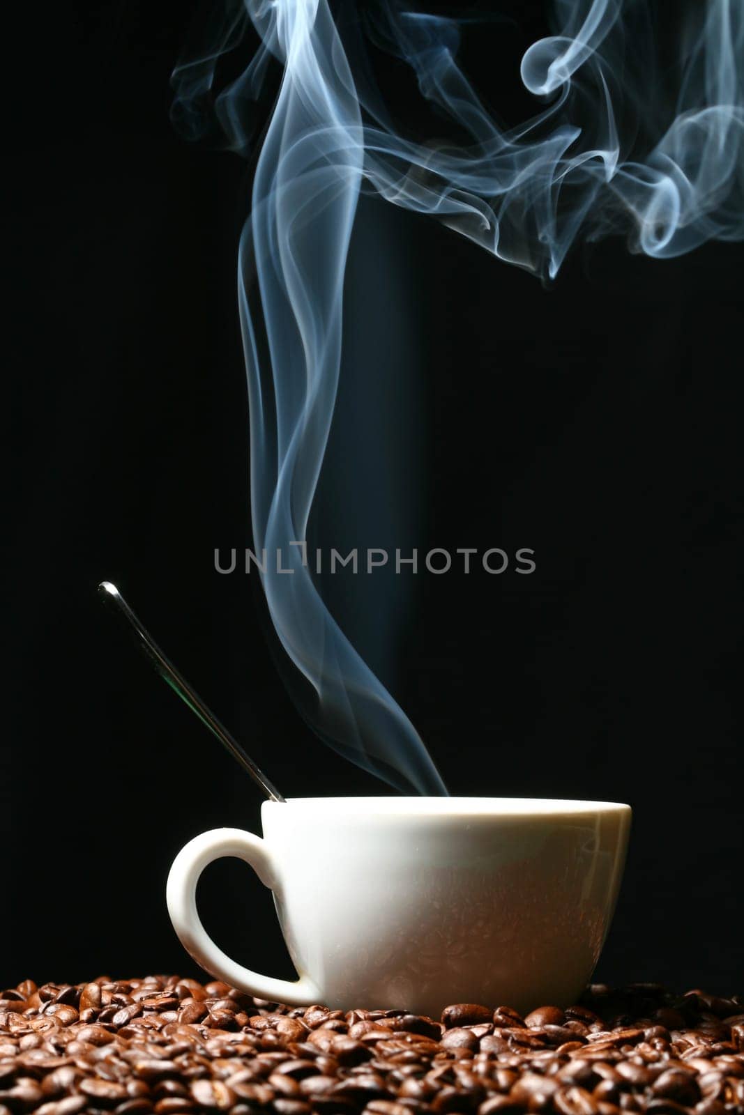 coffee beans and white hot cup of drink