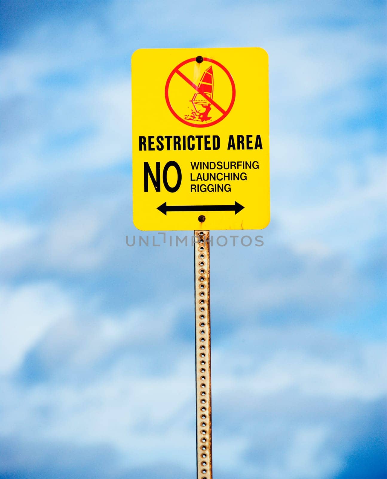 Sign near the ocean or lake warning of no windsurfing, rigging or launching.