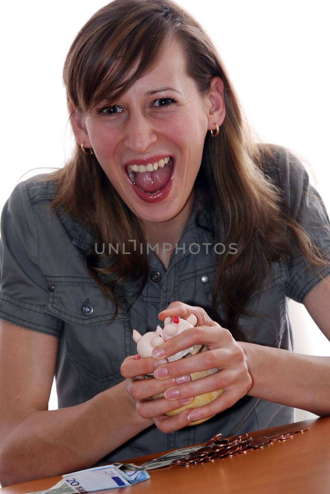 woman takes last coins from money box