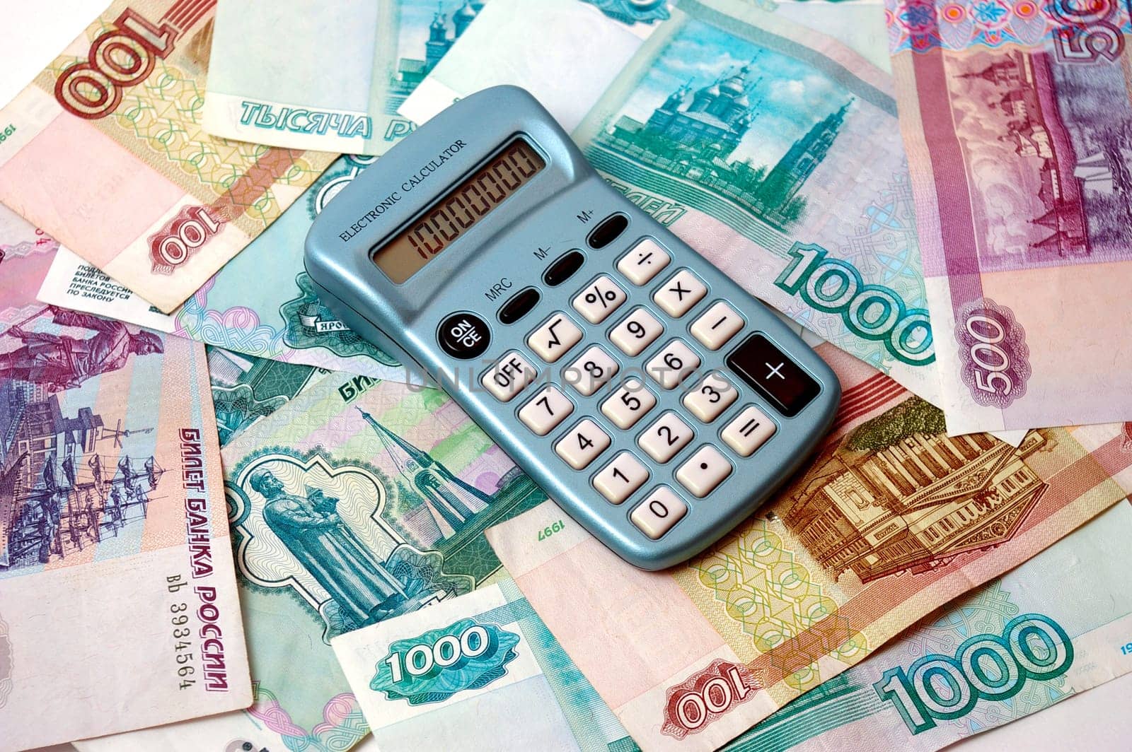 Much russian paper bills. On they lie the calculator.Symbolizes profit.