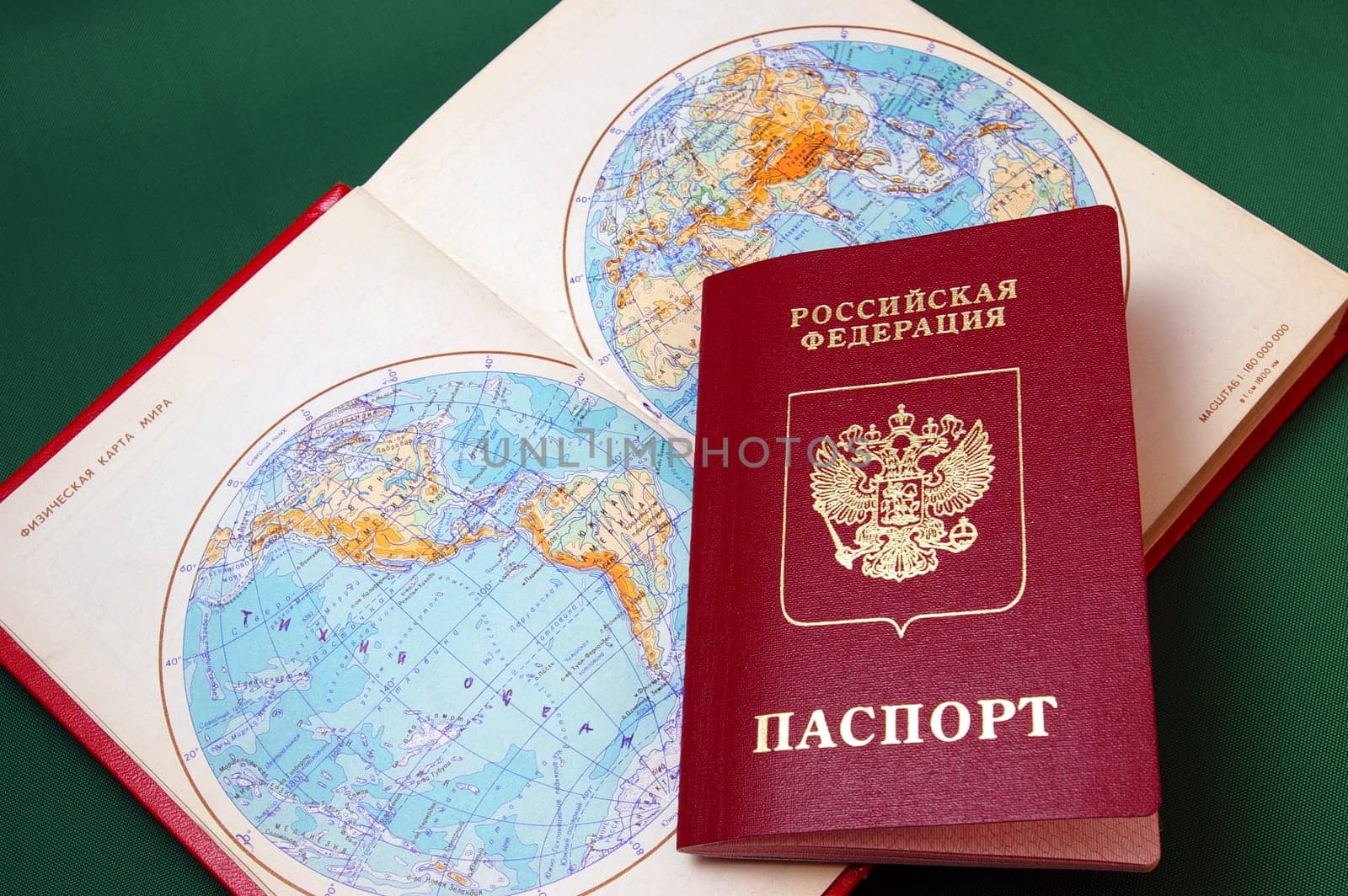 The Foreign passport of the person to Russian Federation and card of the world.