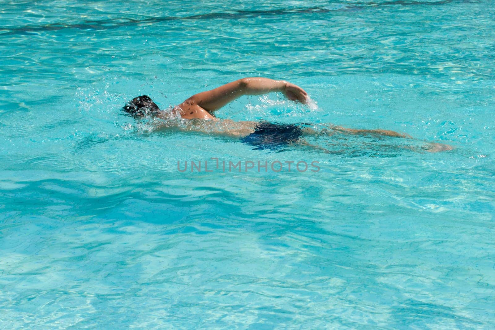Swimming young man (the crawl)