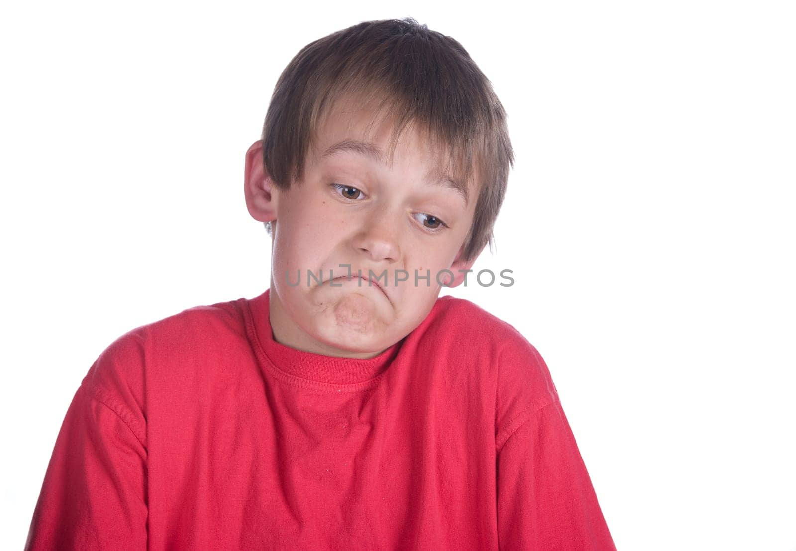 this boy is unsure of something on white