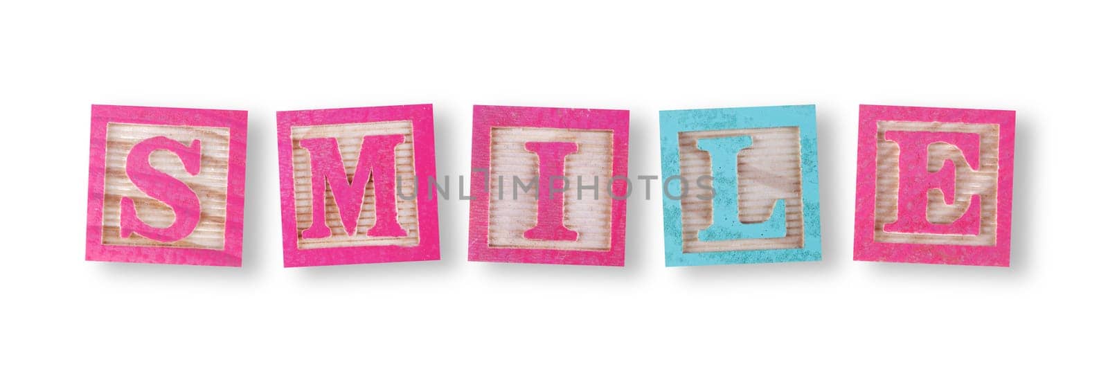 A smile concept with childs wood blocks on white with clipping path to remove shadow