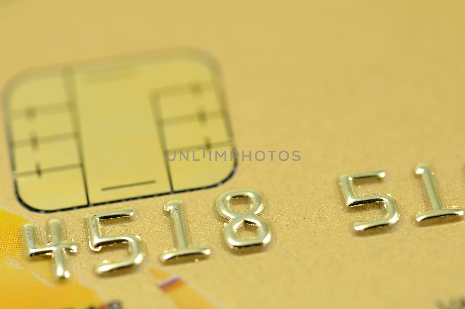 Close up of golden credit card with chip