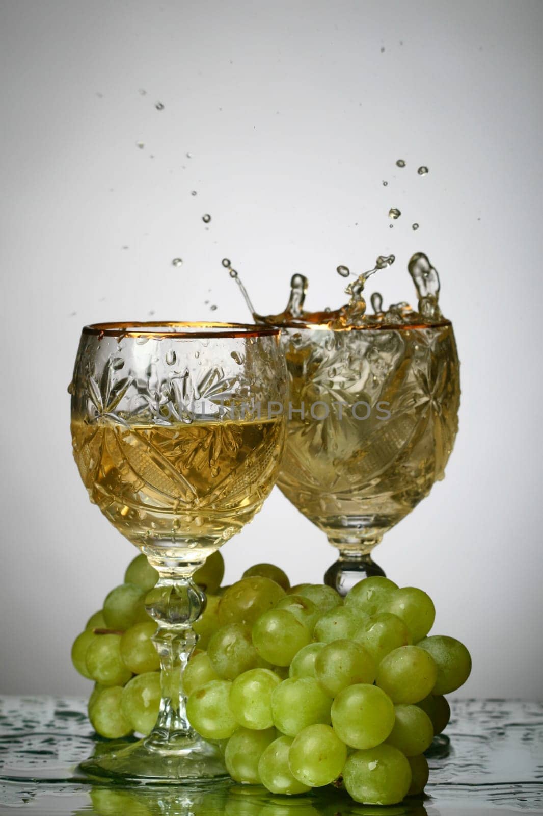 champagne with grape and the green bottle