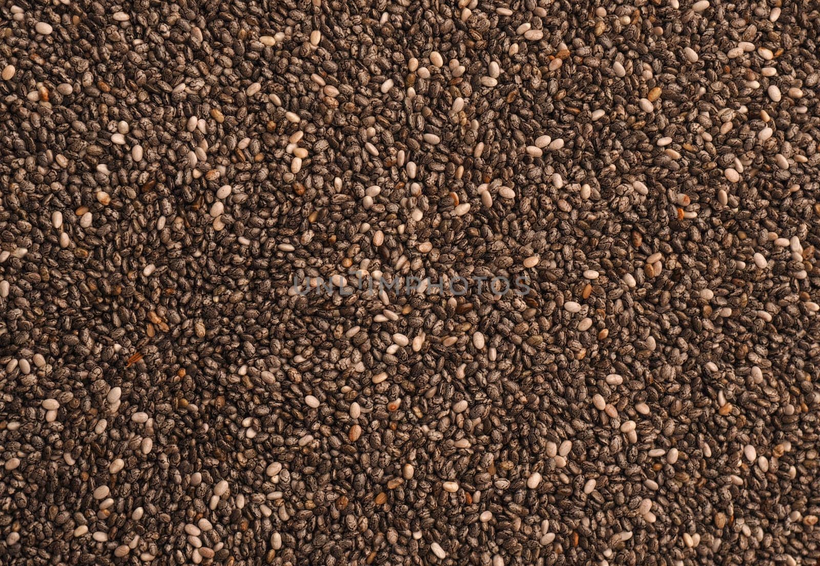 Tasty organic chia seeds using as background, healthy food concept, super food