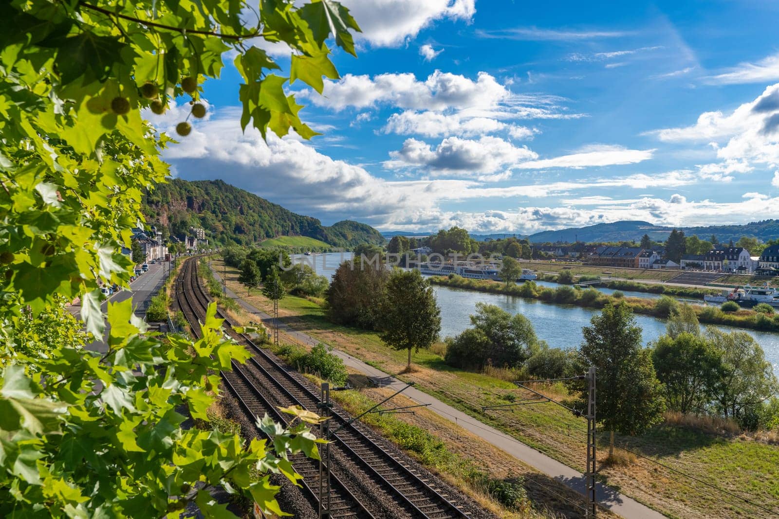 A breathtaking view from the Kaiser Wilhelm Bridge in Trier of the Moselle in a northerly direction in brilliant sunshine.