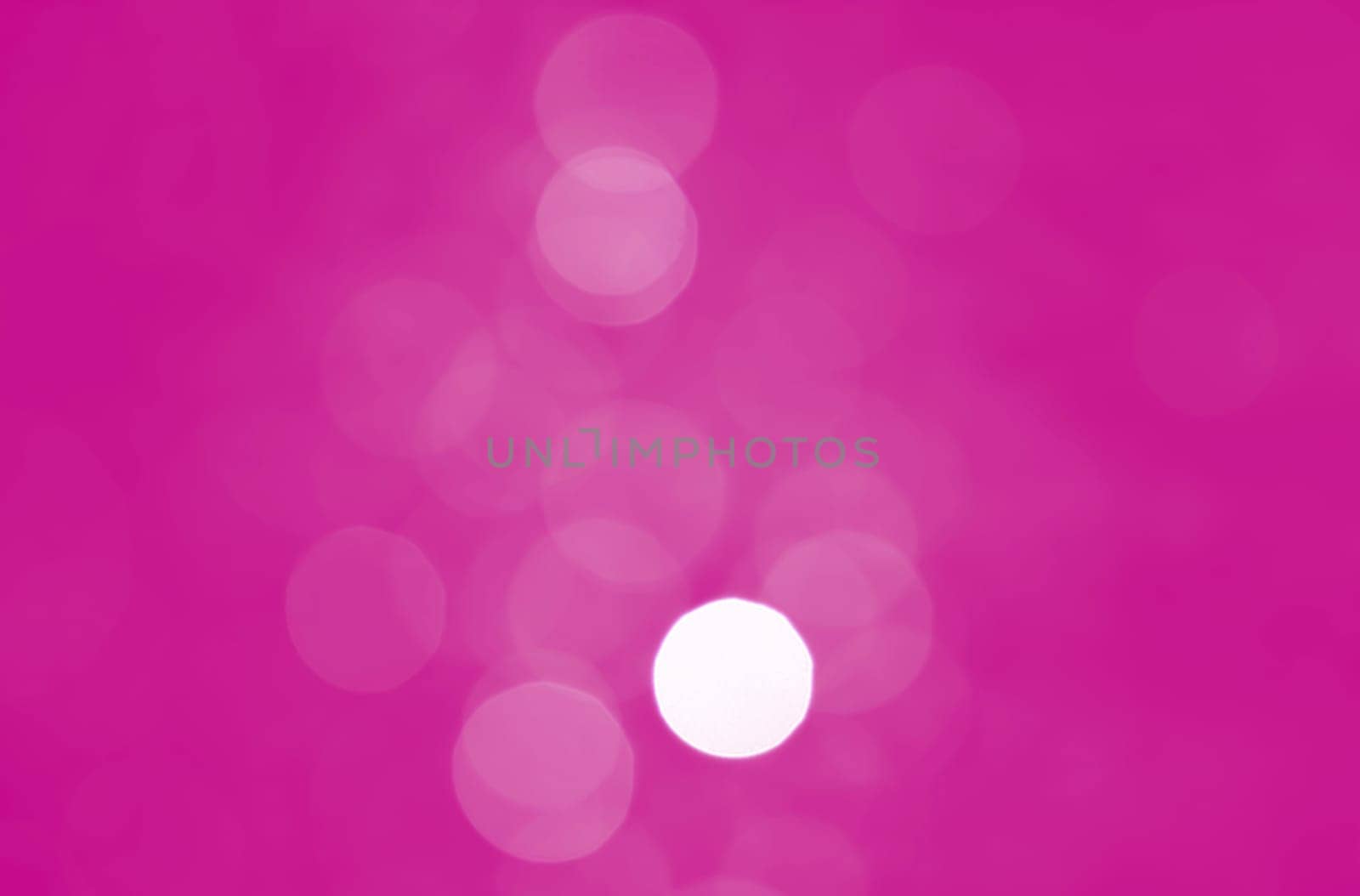 Light abstract pink bokeh christmas circle color glitter blurred black background