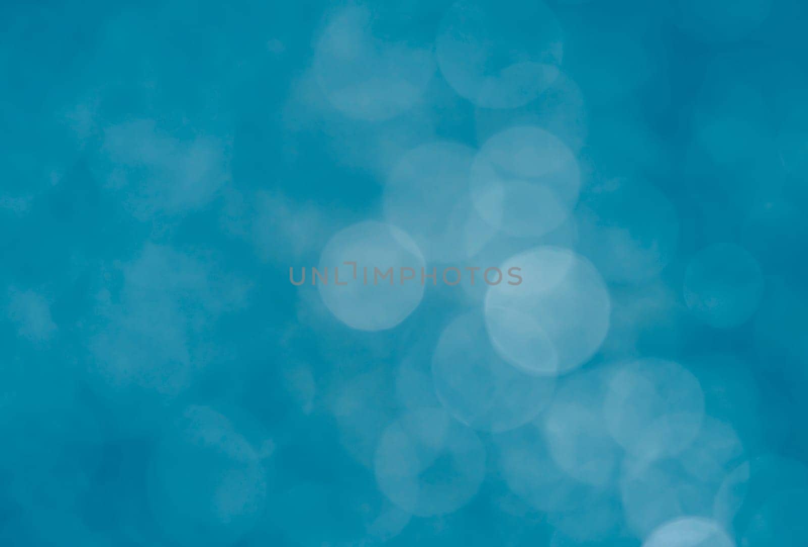 Light abstract blue bokeh christmas circle color glitter blurred black background