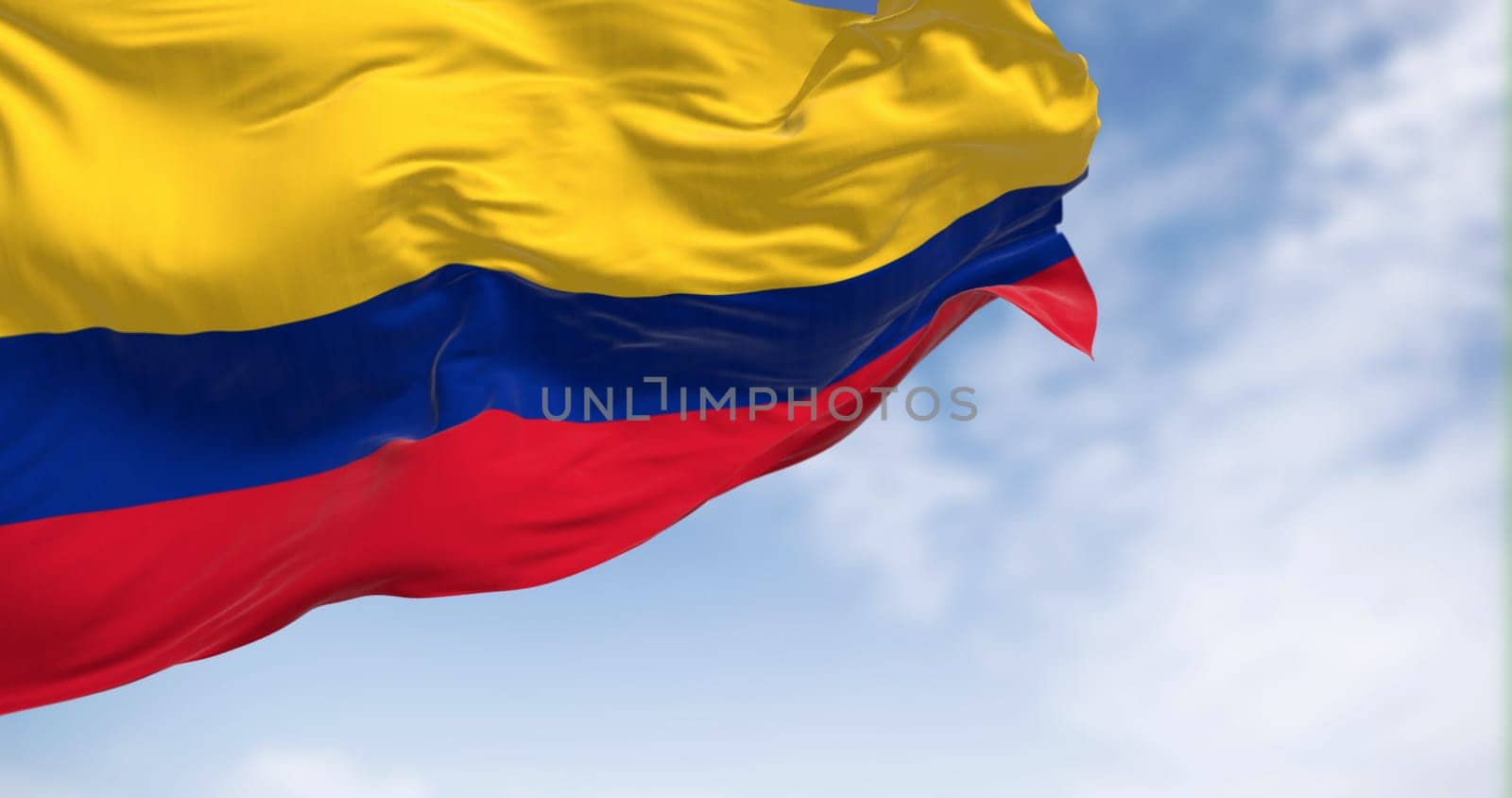 Colombia national flag waving in the wind on a clear day. Horizontal tricolor of yellow (double-width), blue, and red. South american country. 3d illustration render. Fluttering textile