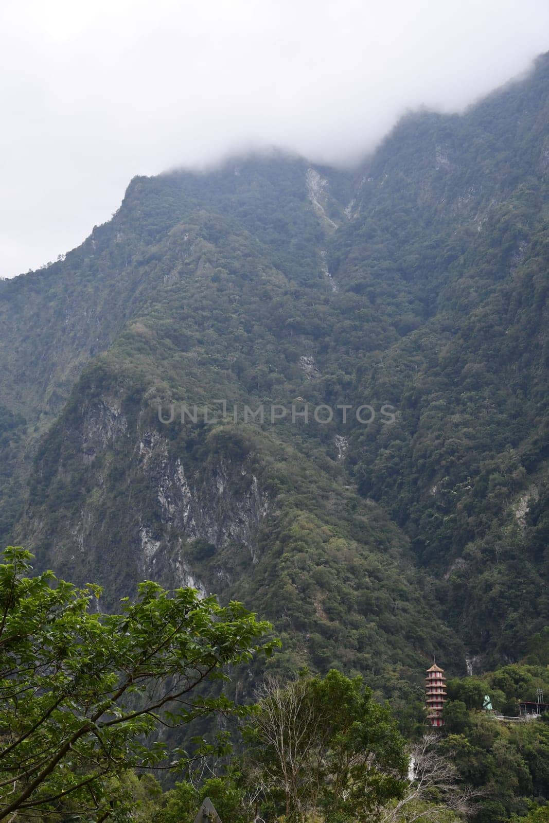 Vertical, beautiful view of hills on a cloudy day in Tianxiang, Xiulin, Hualien, Taiwan