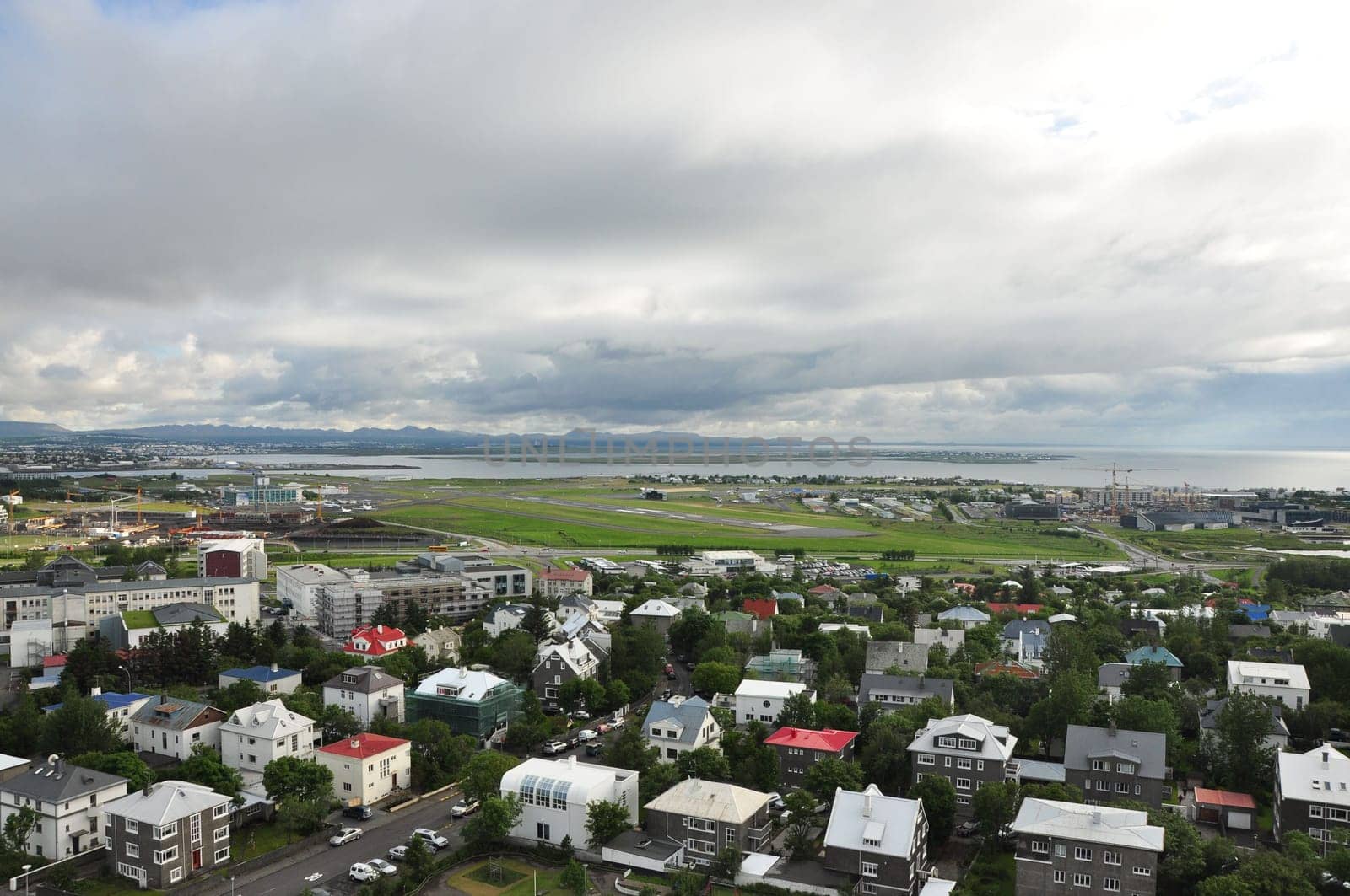 Aerial view of colorful buildings and lush greenery of Reykjavik, Iceland
