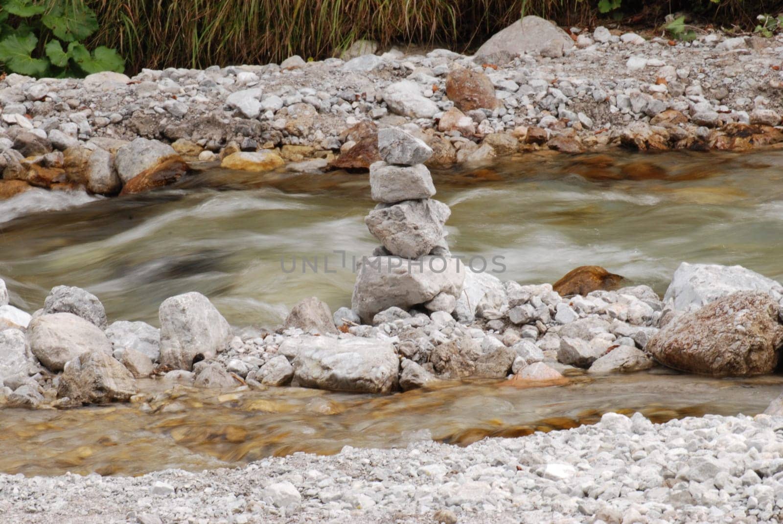 Stones stacked in a river in Berchtesgaden, Bavaria, Germany