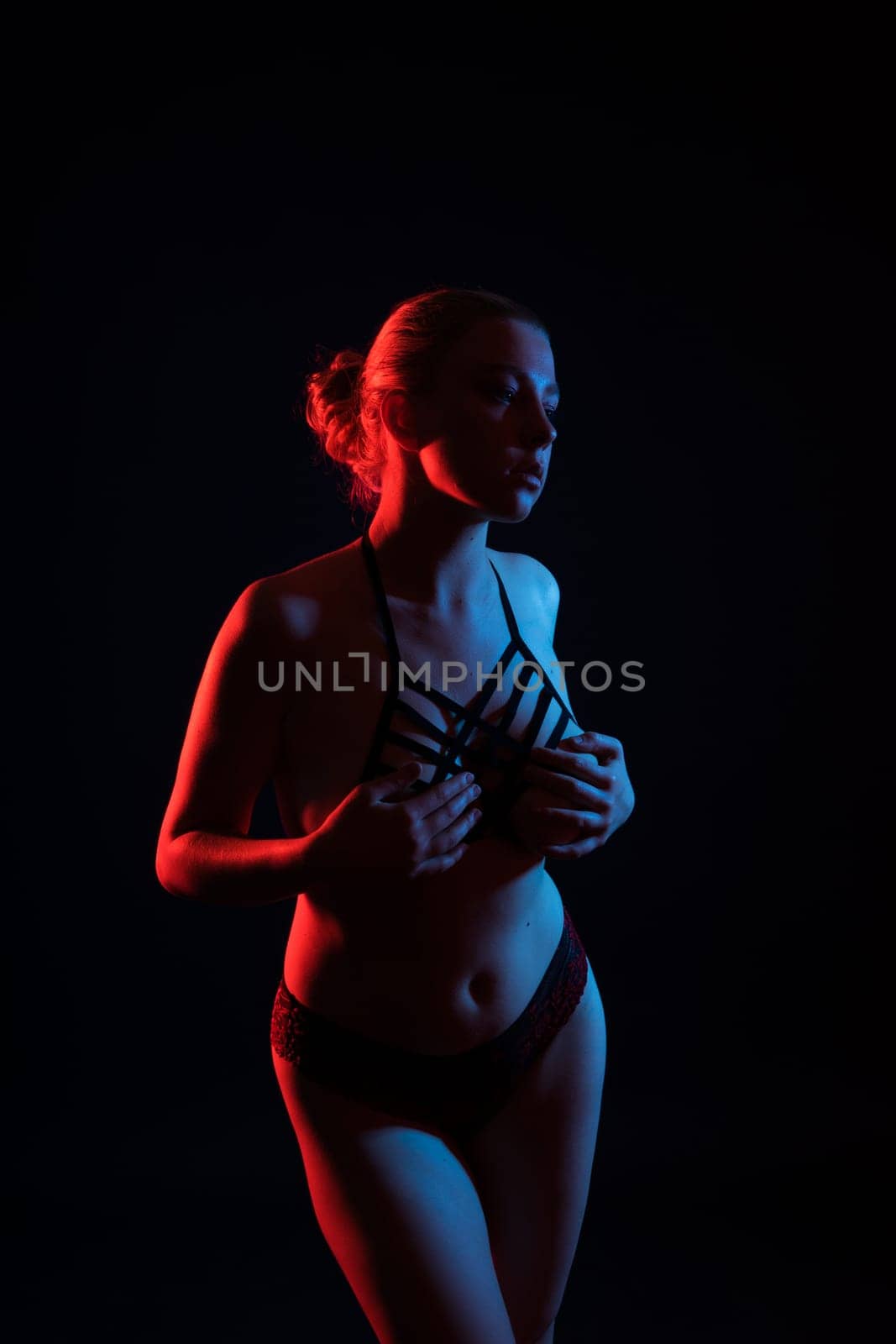 Happy plump body positive blond haired lady poses topless