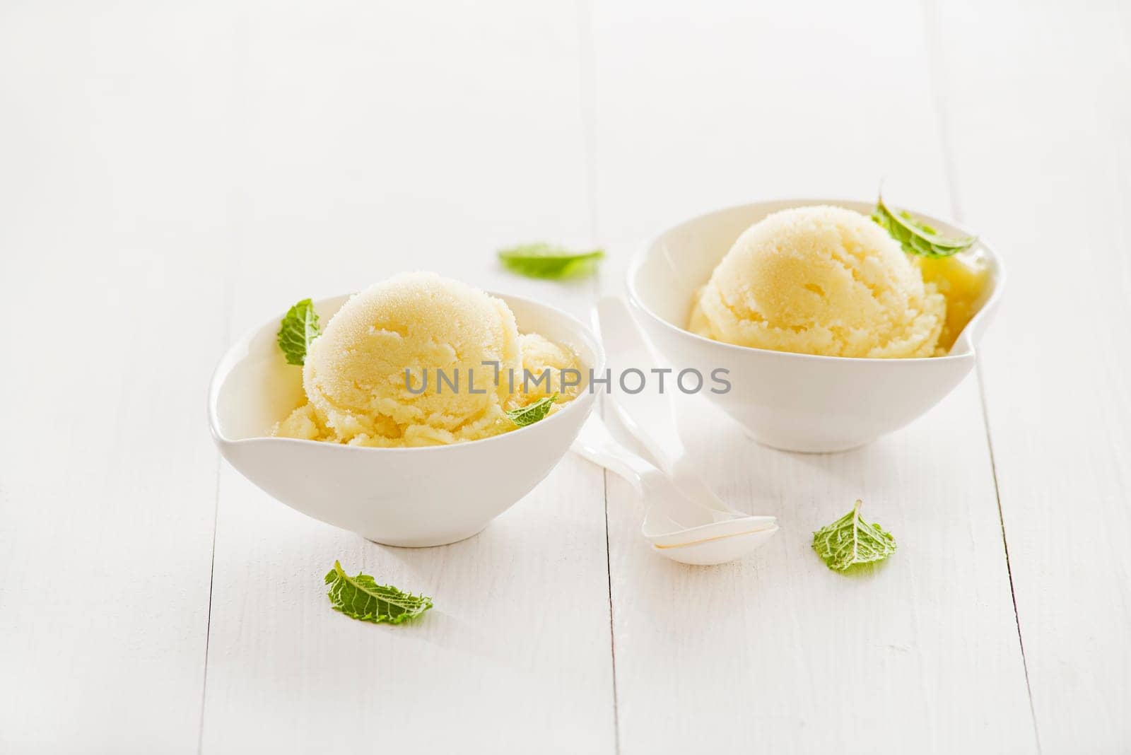 Fresh fruit sorbet ice cream in a white bowl.
