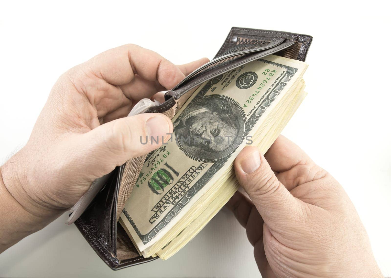 Opening the wallet full of money.