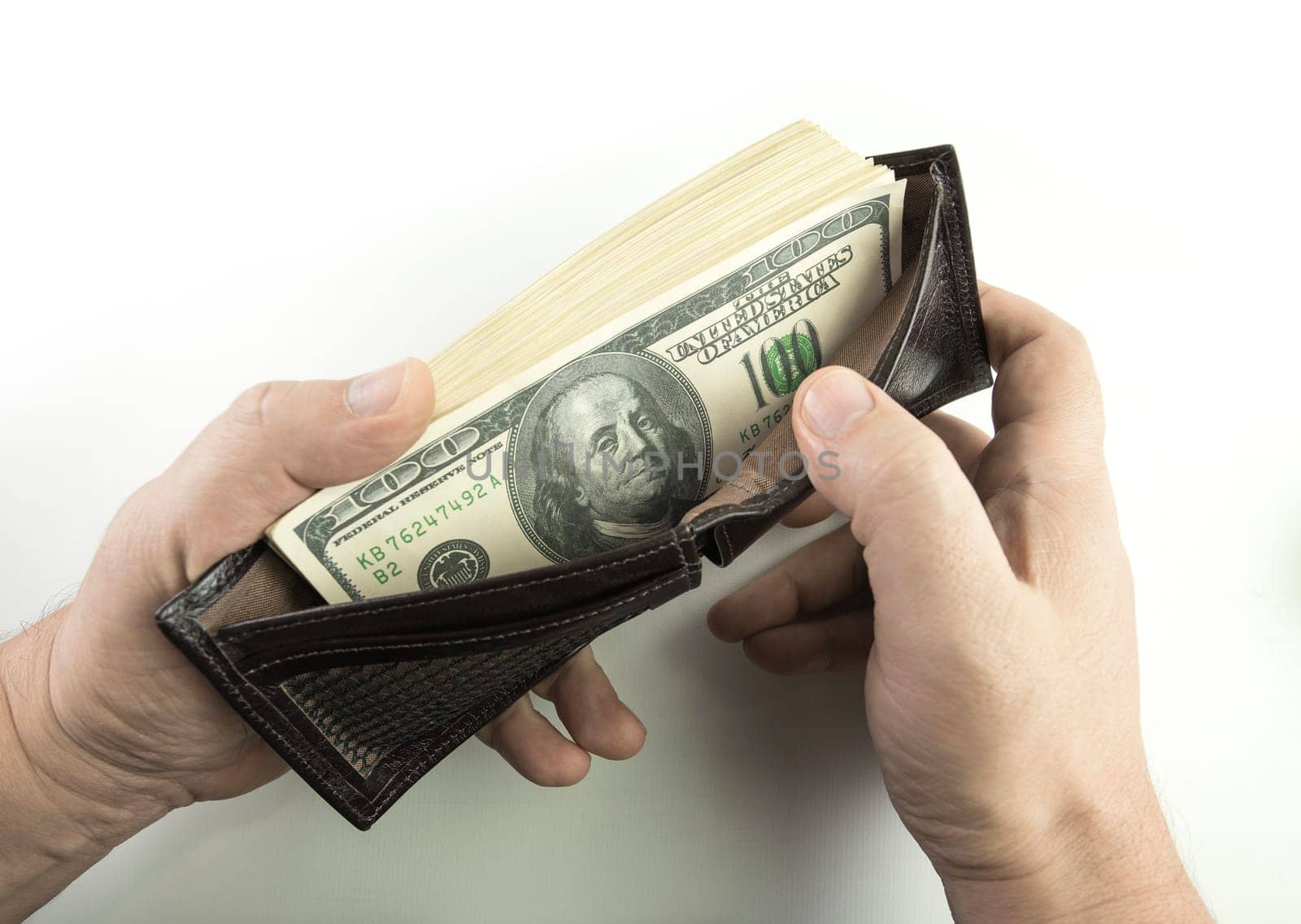 Opening the wallet full of money.
