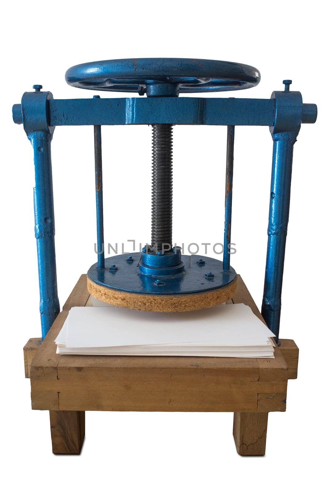 Screw bookbinding press over wooden stand. Isolated over white background
