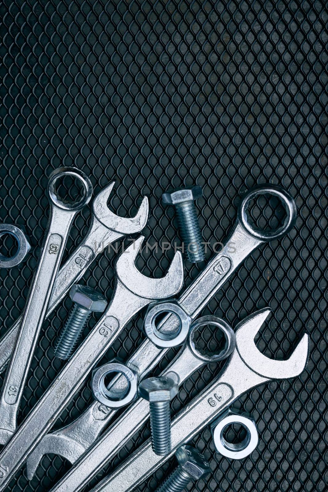 Set of chrome wrenches on steel surface. Mechanic tools for maintenance. Hardware tools to fix. Technical tools background
